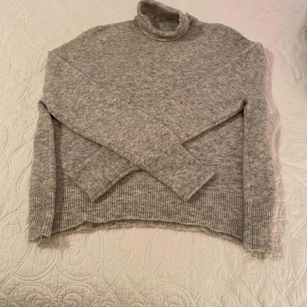 Turtleneck sweater.